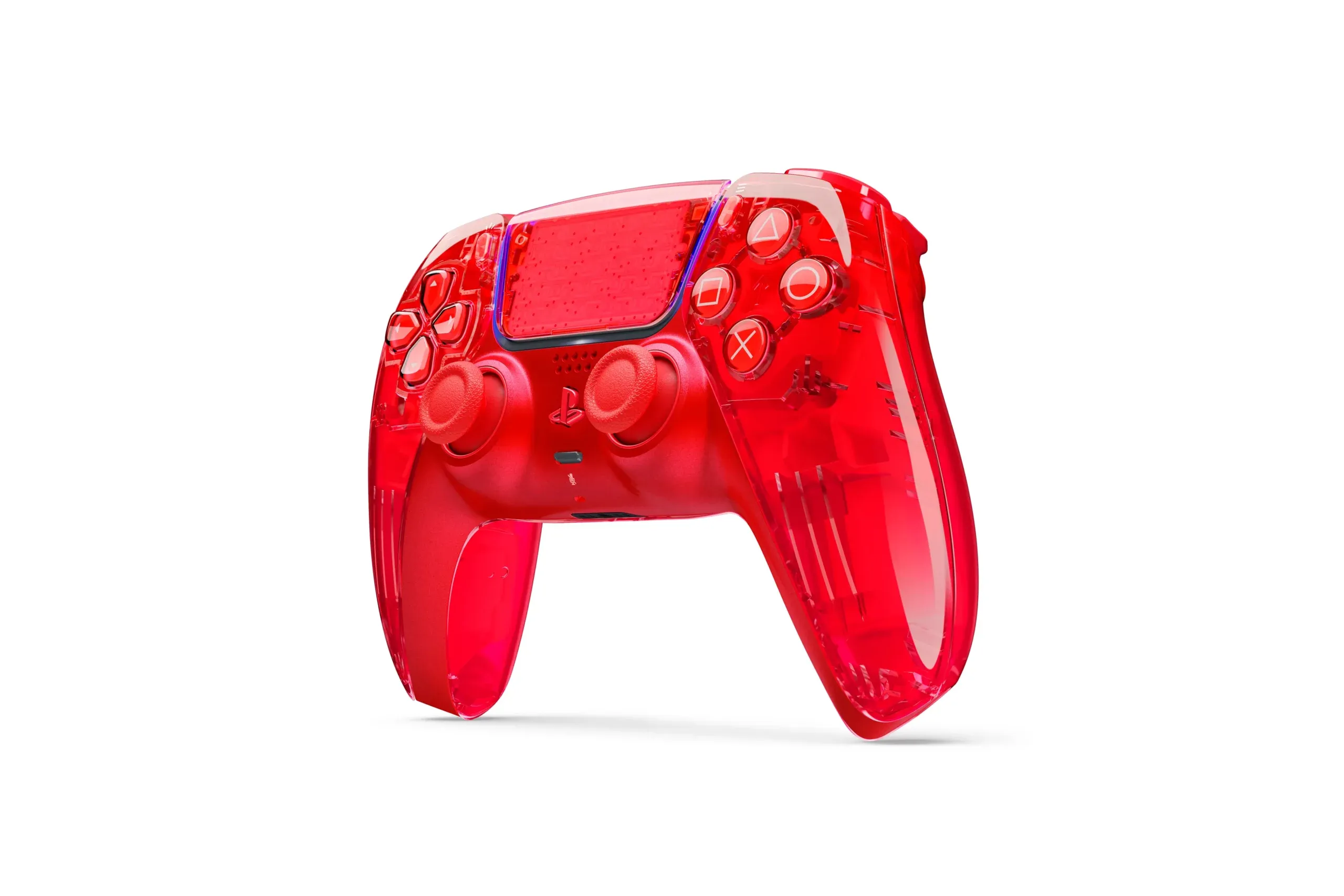 Pady DualSense - przezroczyste kontrolery w kolorach pomaranczowym, zielonym i szarym obok limitowanej edycji Gran Turismo